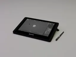 3D modeled graphic drawing tablet with digital pen and interface displayed, compatible with Blender 3D design software.