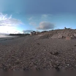 Normandy pebbles beach in the sunset