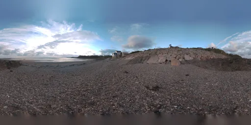 Normandy pebbles beach in the sunset