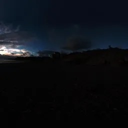 Normandy pebbles beach in the sunset