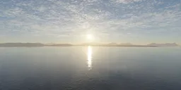 360-degree HDR panorama for virtual lighting featuring a serene sunset with reflective water and distant mountains.