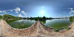 Panoramic HDR image featuring a serene lake with clear blue sky and a rough stone pathway, perfect for realistic lighting in 3D scenes.