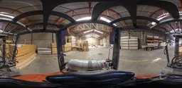 High-resolution industrial warehouse interior HDR from forklift perspective, featuring lumber stacks.