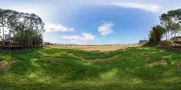 Vibrant HDR panorama of sprawling fields with lush grass and clear skies for scene lighting.
