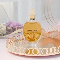 Highly detailed 3D model of a golden perfume bottle for interior visualization, ideal for Blender rendering.