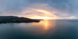 Golden Cloudy Sunrise Sky at Ocean