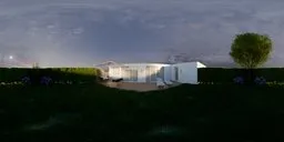 Tranquil garden HDR panorama with lush lawn, purple flowers, white chairs, and umbrella for scene lighting.