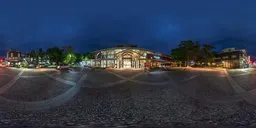 360-degree night-time urban HDR panorama with illuminated building and cobblestone foreground for realistic lighting.