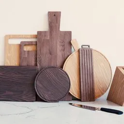 "Kitchenware Pack 1 - A collection of kitchen items including cutting boards and knives on a countertop made in 2019 for Blender 3D. The set features clearly defined outlines and beautiful walnut wood textures. Perfect for creating realistic interior scenes."