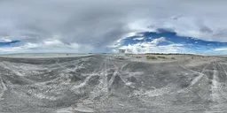 360-degree panorama of a natural beach scene with blue cloudy sky at sunset for HDR lighting.