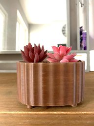 Ribbed stadium shaped planter