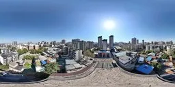 360-degree panoramic HDR image featuring an urban skyline with old buildings under clear sunny skies, ideal for realistic lighting in 3D scenes.