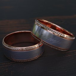 "Engraved wedding ring with diamonds on wooden surface in Blender 3D. Created with Daz3d Genesis Iray shaders and features copper etched inscriptions. Precious stones and intricate design make for a beautiful and unique ring."