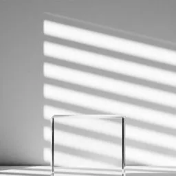 Minimalistic 3D-rendered square glass podium with geometric shadows, ideal for product display in Blender visualizations.