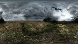Dramatic cloud formations over a serene field, perfect for scene lighting despite being a single-exposure HDR image.