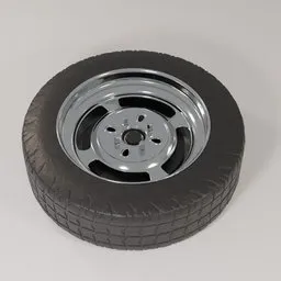 "Retro Steel Rims & Tire, a high-quality 3D model for Blender 3D. This replica model features a black rim with a silver spoke on a white surface, providing a sleek and classic look. Perfect for enhancing the visual appeal of your virtual vehicle projects. Created using Blender 3D software."