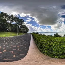 A cloudy brick-paved road