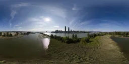 Cityscape by River, Sunny Day