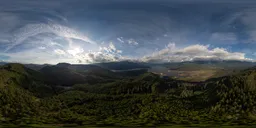 Panoramic HDR environment of cloudy sky over mountains at sunset for scene lighting.