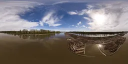 Logs in River Sunny Cloudy Day