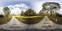 360-degree HDR image showing a flagstone pathway with surrounding grass and trees under a partly cloudy sky.