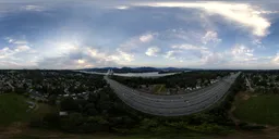 Cloudy Sunset over Suburban City