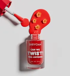 Nail enamel spilled with flowers shot