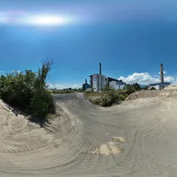 Abandoned factory on sandy land