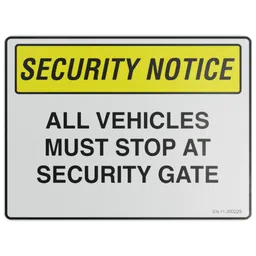 Sign – Security Notice. All Vehicles Must Stop at Security Gate.