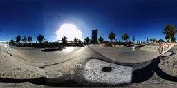 Skate park panoramic HDRI with dynamic sunlight and blue sky for realistic scene illumination.