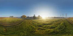 Sunrise over a dew-covered field with radiant sunlight for realistic lighting in 3D scenes.
