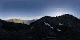 High-resolution HDR panorama of snow-capped peaks and alpine terrain for realistic scene lighting.