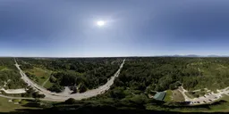Bright overhead HDR panorama for realistic lighting in 3D scenes, with clear skies and lush greenery.