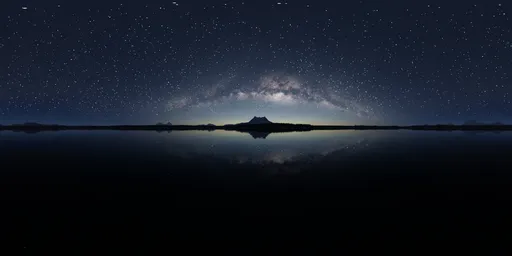 Starry sky with Milky Way over tranquil lake reflection and silhouette of mountains for HDR lighting.