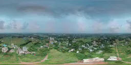 Drone-captured urban HDR panorama for realistic lighting in 3D scenes with clouds.