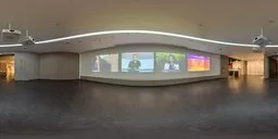 Modern briefing room HDR with ambient lighting from screens for scene illumination.