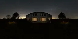 360-degree night HDR panorama of a house with illuminated windows, surrounded by manicured garden and starry sky.