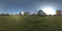 17k HDR panorama of a grassy urban park with modern architectures under clear skies, perfect for realistic scene lighting.