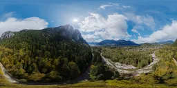 High-resolution 17k HDR image featuring sunlit mountain ranges with dynamic clouds for scene lighting.