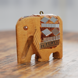 "Handcrafted small elephant keychain made from wood and metal, inspired by the artistic style of Thawan Duchanee. This 3D model is rendered in 4K resolution using the V-Ray engine and features a defocused background. Perfect for crafts and souvenir enthusiasts, based on a geographical map. Designed for Blender 3D."