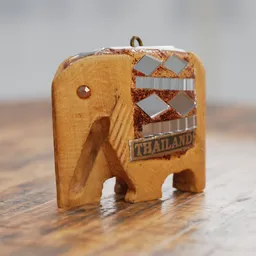 "Handcrafted small elephant keychain made from wood and metal, inspired by the artistic style of Thawan Duchanee. This 3D model is rendered in 4K resolution using the V-Ray engine and features a defocused background. Perfect for crafts and souvenir enthusiasts, based on a geographical map. Designed for Blender 3D."