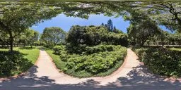 Lush garden HDR with vivid greenery, clear sky, and natural shadows perfect for realistic scene lighting.