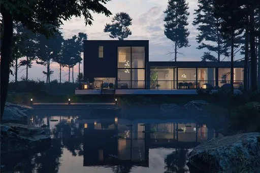 View of the luxurious villa with a pond at sunset