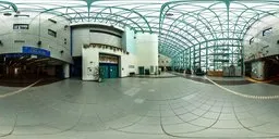 Spacious interior HDR panorama of a blue hall with a green metal roof structure for scene lighting.