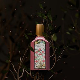 3D-rendered bottle with floral design showcased amid dark leaves for product visualization in Blender.
