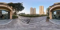 360-degree HDR panorama of a wedding store entrance at evening with surrounding highway and cityscape.