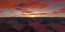 Sunset illuminating clouds and mountaintops in a high-definition aerial HDR image.