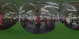 360-degree HDR image of a well-lit, spacious indoor gym with fitness equipment.