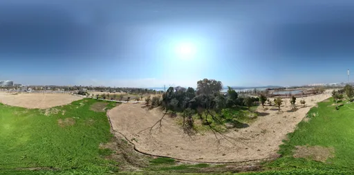 Sunshine clouds green grass mud