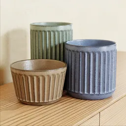 "Japanese-inspired Ribbed Pots with changeable colors, featuring handcrafted details and solid concrete material. Textured with high-quality 2k textures, this Blender 3D model adds a touch of warmth and elegance to any collection."